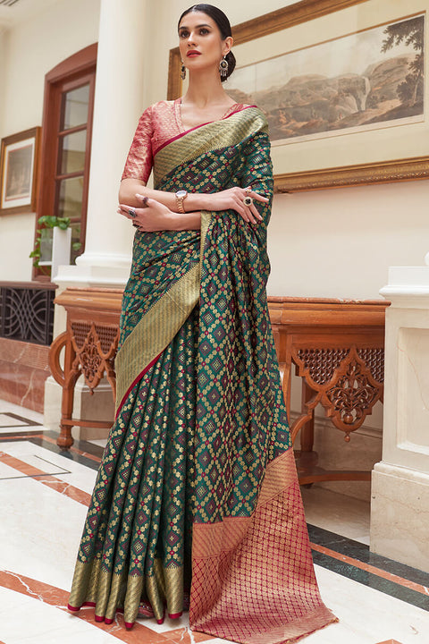 VastraLakshmi Staggering Dark Green Soft Patola Silk Saree with Imaginative Blouse Piece