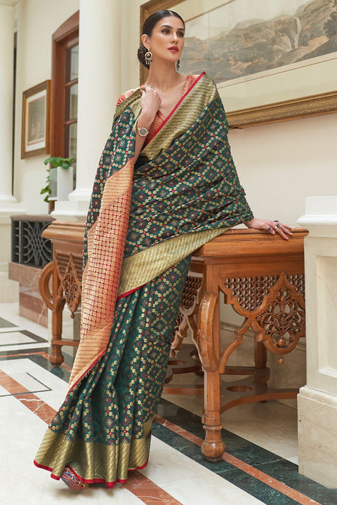 VastraLakshmi Staggering Dark Green Soft Patola Silk Saree with Imaginative Blouse Piece