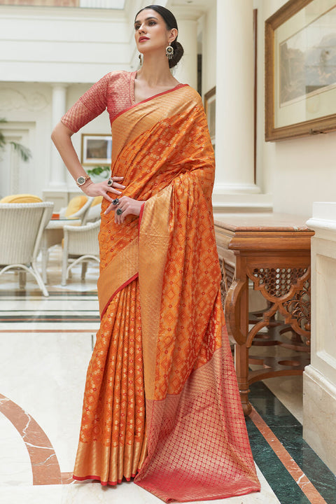 VastraLakshmi Embrocation Orange Soft Patola Silk Saree with Brood Blouse Piece