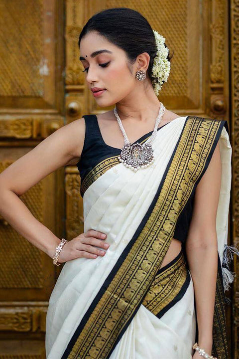 VastraLakshmi Surpassing Off White Soft Silk Saree With Flameboyant Blouse Piece