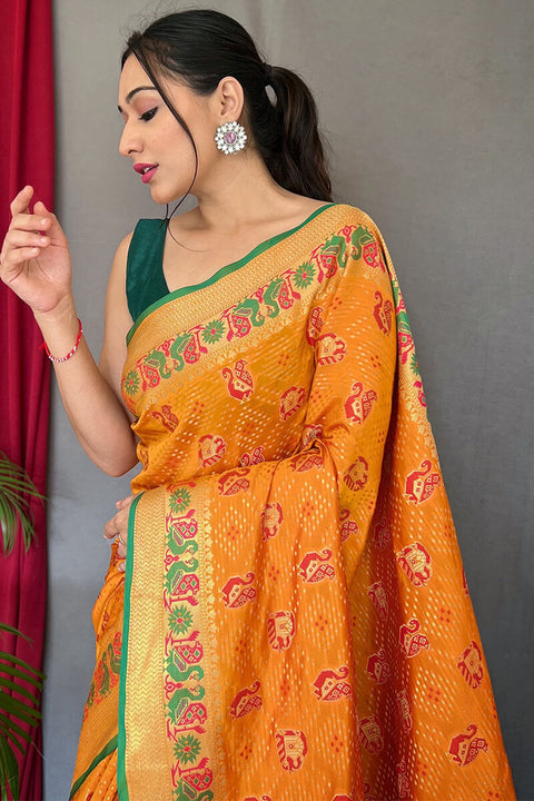 VastraLakshmi Embrocation Orange Patola Silk Saree with Lagniappe Blouse Piece