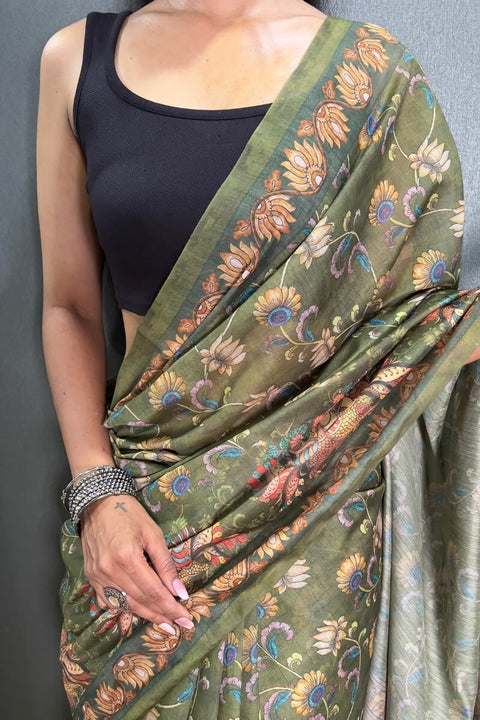 VastraLakshmi Captivating Green Kalamkari Printed Saree With Prominent Blouse Piece